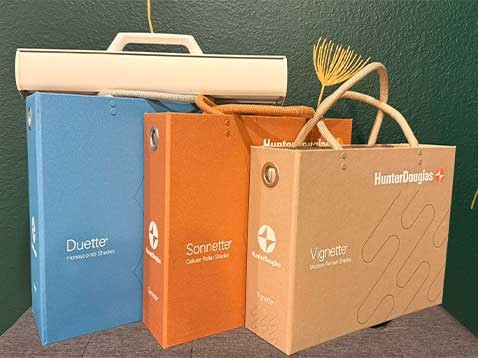 Hunter Douglas branded cases displayed on a table
