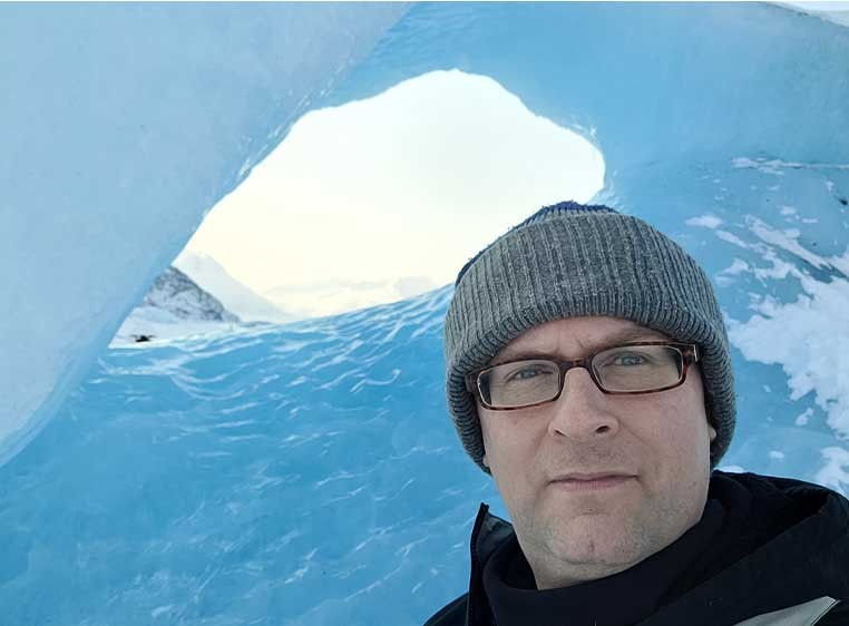 Portrait of a man in an ice cave